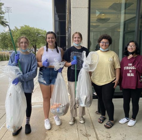 Photo of Green Team members picking up trash in the Burke parking lot after school. Photo courtesy of @burke_greenteam Instagram page. 