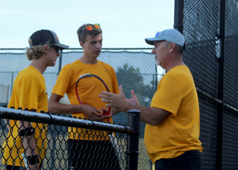 As senior Nathaniel Otten plays doubles against Buena Vista, Coach Shafer pulls Otten and his partner, freshman Robert Peirce aside to talk strategy. Otten finished the talk and ended the match with an amazing swing. “When I talk with coach during matches, I like to point out my opponents playing style and weaknesses and how I want to attack them,” Otten said.