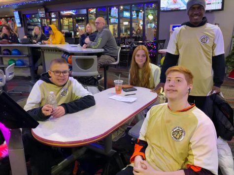 After a fifth-place finish at the Unified Bowling District Tournament, the team leaders (Raynier Harrington, Ethan Dean, Jada Williams, Aiden Meurrens) sit and pose for a picture. The team collectively earned 439 points which was not enough to continue on to the NSAA State Unified Bowling Tournament. Photo by Crystal Ishii