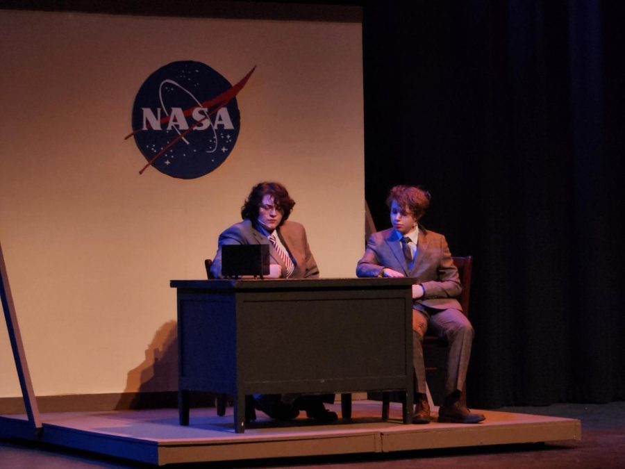 Brown and Atkinson who are played by Michael White and Jude Hornstein, enjoy some donuts while discussing why having a female astronaut would or would not NASA 