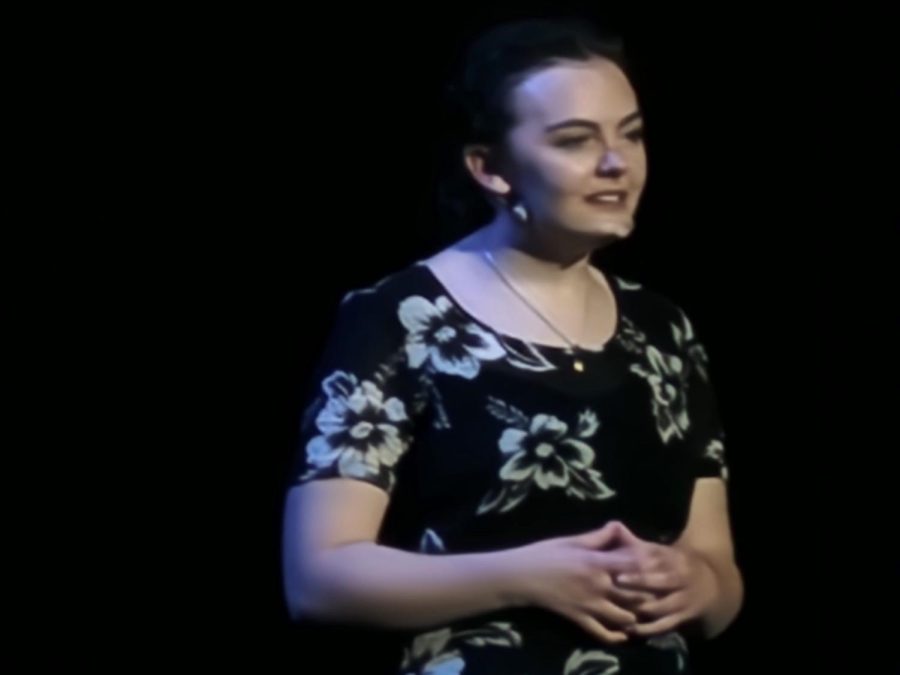 Fran Douglass, played by Stella Clark-Kaczmarek, talks to the audience about what it’s like flying a plane and being a pilot. She describes everything a pilot sees, hears, and feels while flying.  