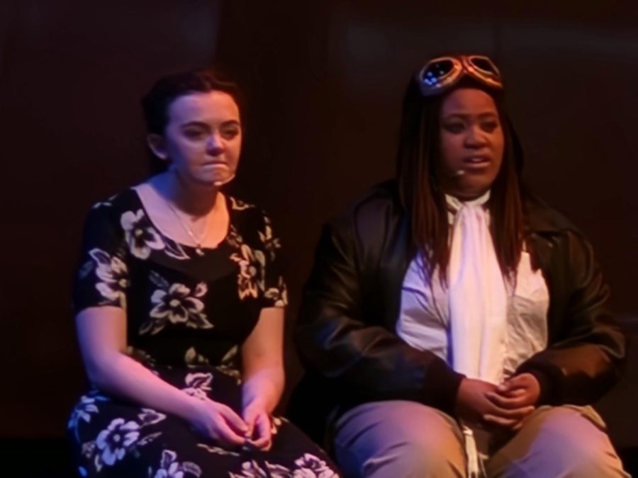 Fran Douglass and Bessie Coleman, played by Stella Clark-Kaczmarek and Olivia Wells discuss how Fran has sadly failed to pursue her dreams of becoming an astronaut. 