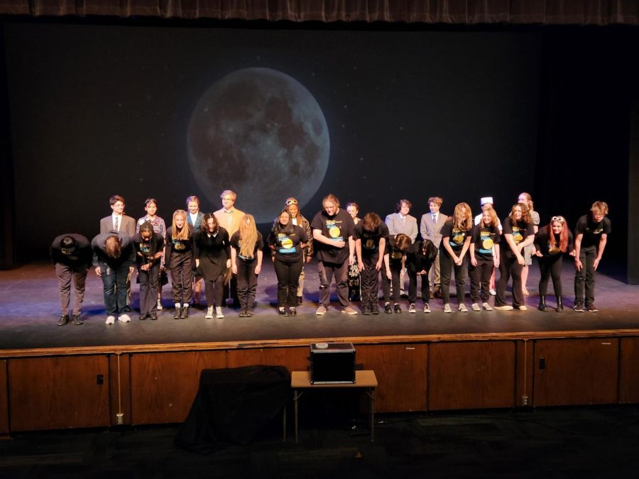 The cast and set crew of "Flyer" bow to the audience after a successful show