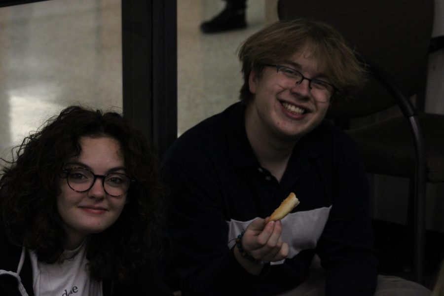 Stella Clark-Kaczmarek and Eli Zagurski, along with the rest of the Burke Bonanza helpers take a break enjoy Little Caesars pizza after a busy afternoon of helping set up for Burke Bonaza