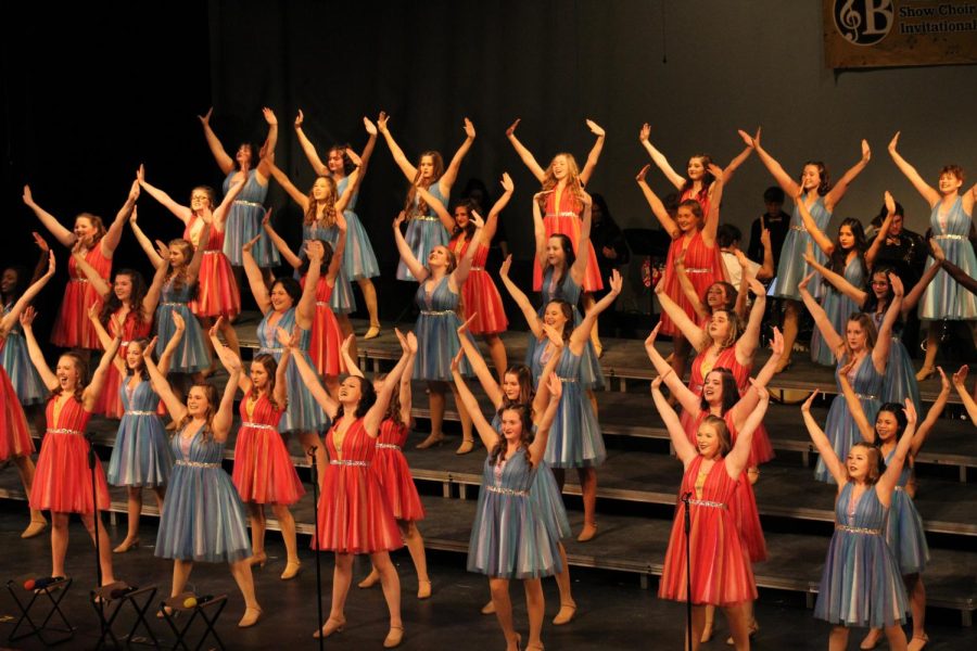 Going from black and white to blue and pink, the female group Stage One from Millard South performs at Burke Bonanza.