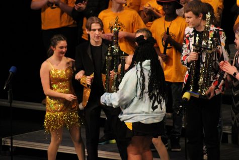 Taking place as second runner-up, Millard South South on Stage accept their award from Burke Synergy member Olivia Wells at finals.