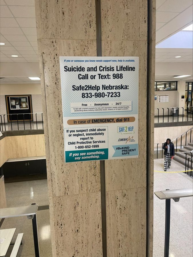 Safe2Help poster near the main staircase.