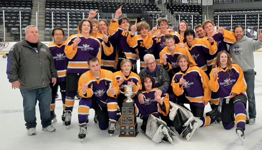 The Omaha Metro Hockey team celebrates after winning their State Championship. The team is made up of boys from 5 different OPS schools and 3 other schools from the metro area. Photo courtesy of Brian White