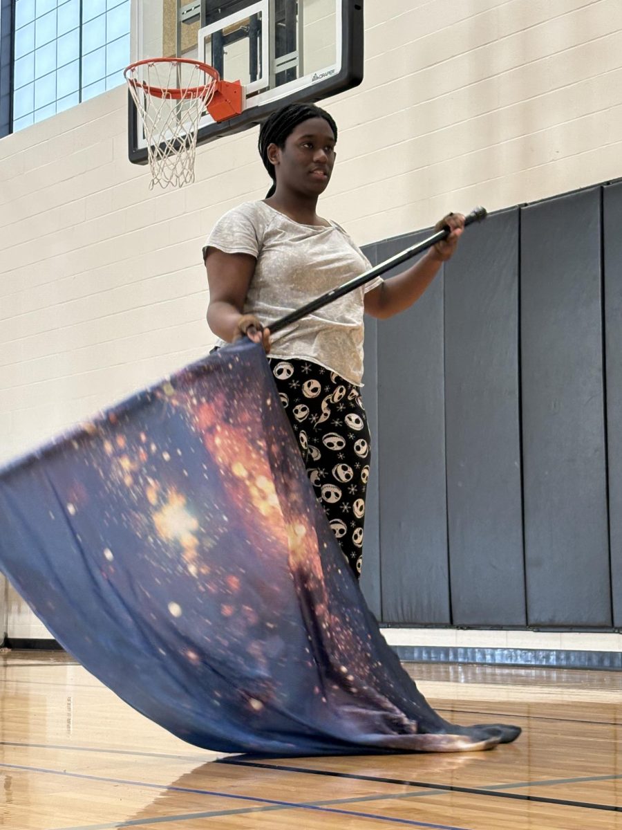 Ziannah Grandy is seen practicing the winter guard audition choreo, making sure she can perform her best.