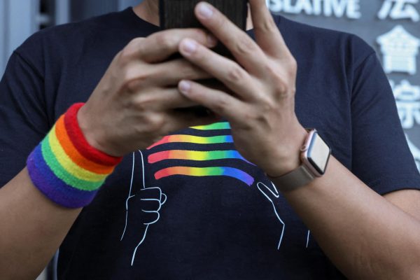 LGBTQ activist Jimmy Sham speaks to media outside the Legislative Council Building after lawmakers vote on the registration of same-sex partnerships bill, which allows couples registered abroad to register locally, in Hong Kong, China, September 10, 2025. REUTERS/Tyrone Siu