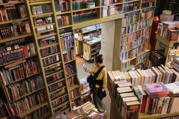 A visitor looks at a book in a bookstore in Saint Petersburg, Russia September 1, 2025. REUTERS/Anton Vaganov