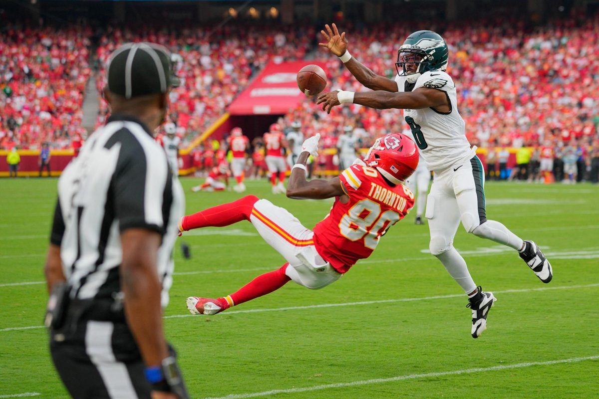 Sep 14, 2025; Kansas City, Missouri, USA; Philadelphia Eagles cornerback Adoree' Jackson (8) breaks up a pass intended for Kansas City Chiefs wide receiver Tyquan Thornton (80) during the fourth quarter of the game at GEHA Field at Arrowhead Stadium. Mandatory Credit: Jay Biggerstaff-Imagn Images