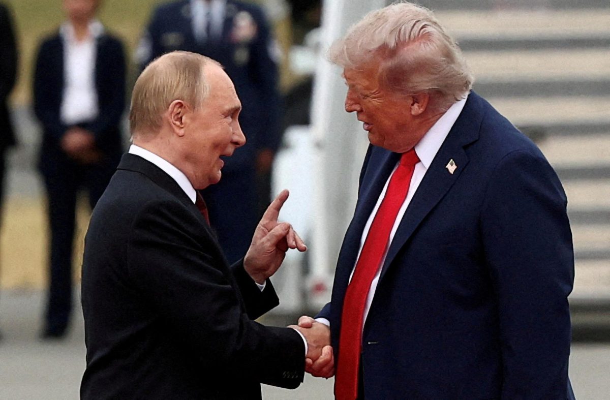 U.S. President Donald Trump shakes hand with Russian President Vladimir Putin, as they meet to negotiate for an end to the war in Ukraine, at Joint Base Elmendorf-Richardson in Anchorage, Alaska, U.S., August 15, 2025. REUTERS/Kevin Lamarque