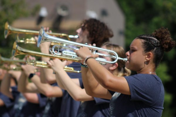 Dayvie White (12) plays the trumpet with the Burke ensemble during their March-A-Thon performance.