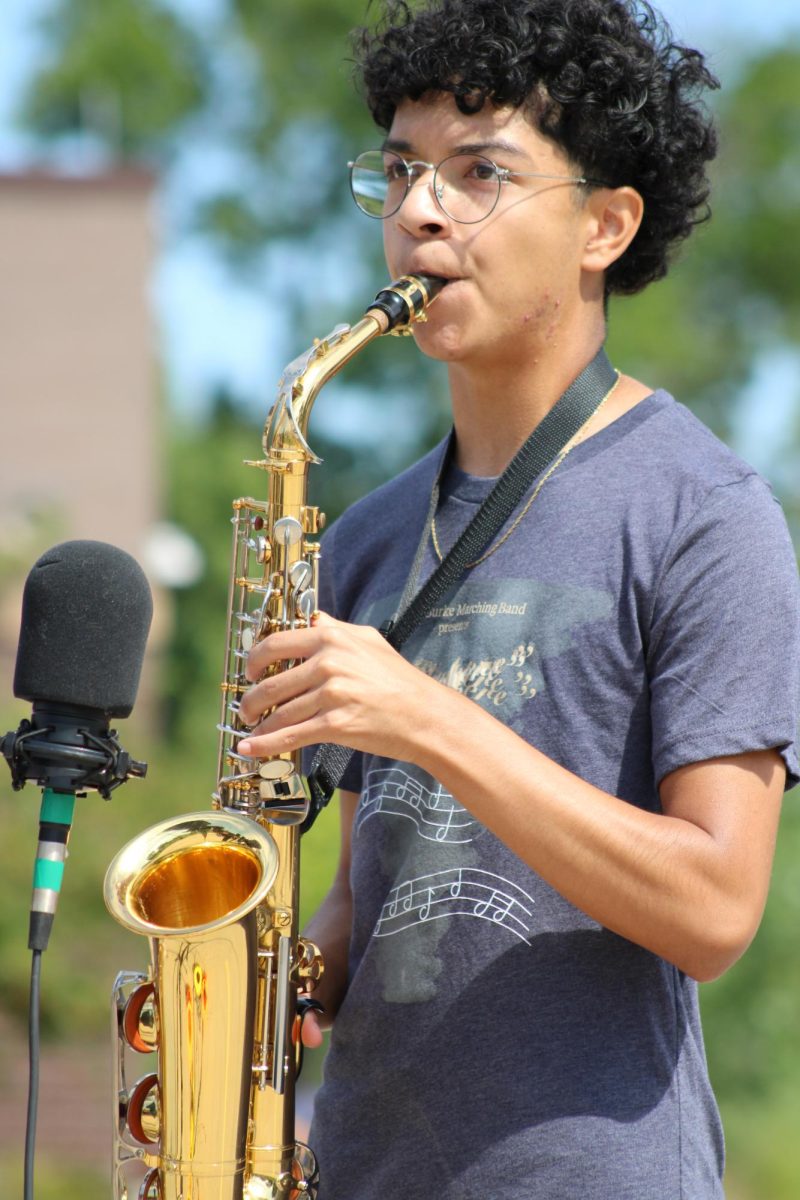 Santiago Garcia (10) plays his solo during the March-a-Thon standstill performance at Colombian Elementary