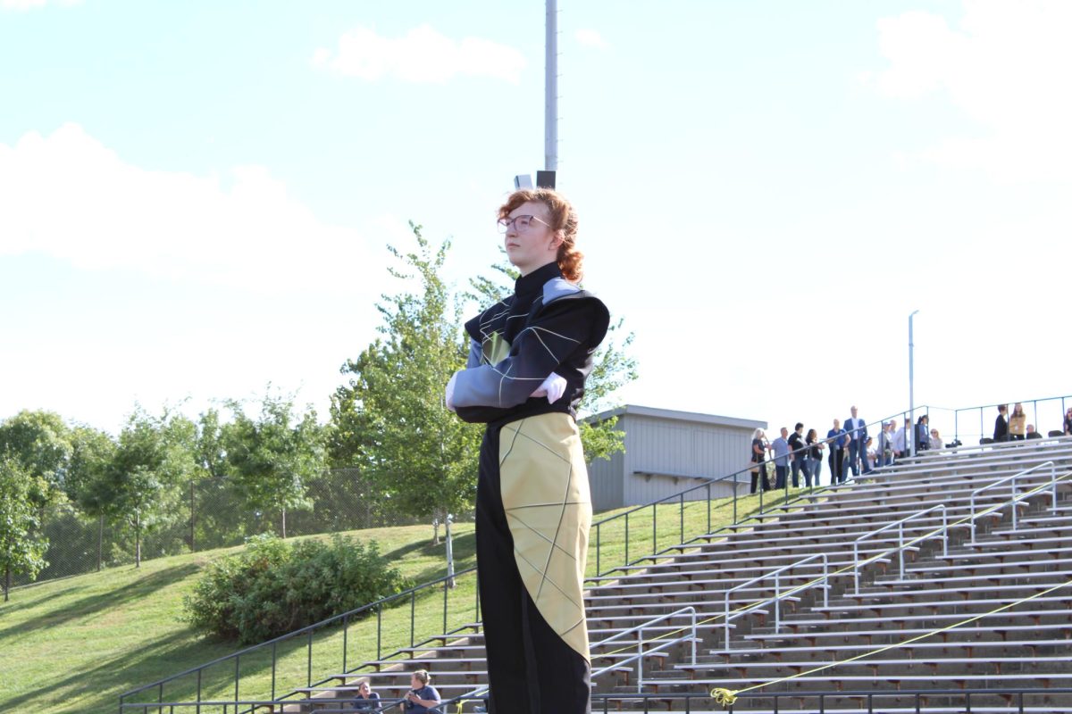 Drum Major, Valerie King, standing on the podium