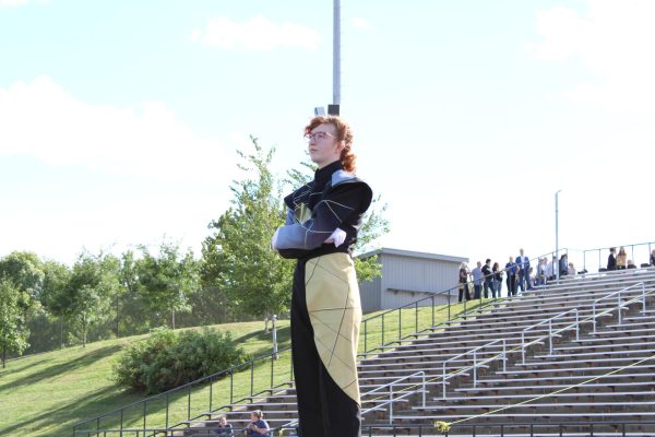 Drum Major, Valerie King, standing on the podium
