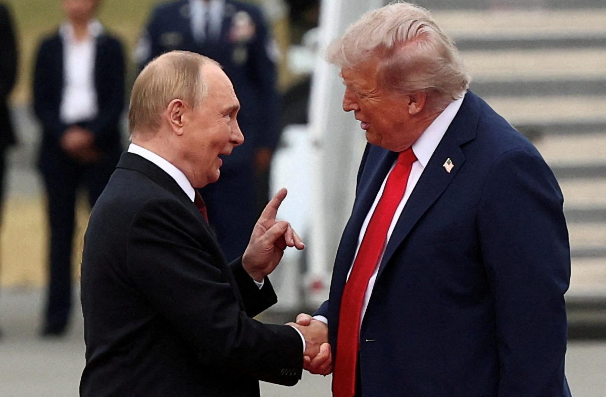 U.S. President Donald Trump shakes hand with Russian President Vladimir Putin, as they meet to negotiate for an end to the war in Ukraine, at Joint Base Elmendorf-Richardson in Anchorage, Alaska, U.S., August 15, 2025. REUTERS/Kevin Lamarque