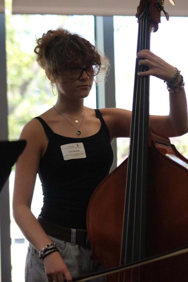 Sophomore Esme Safranek plays bass at the University Of South Dakota Convention. 