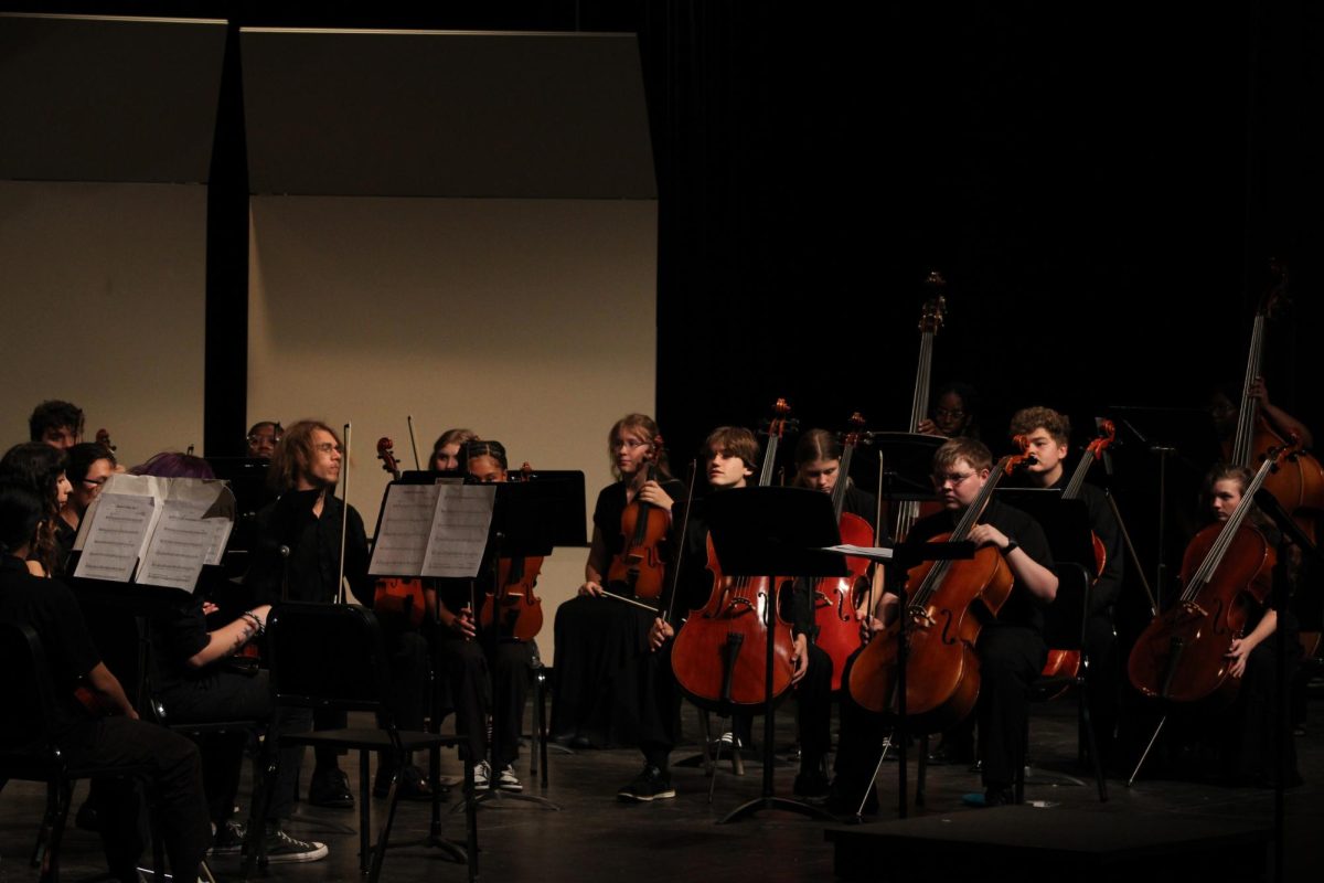 String Orchestra prepares for their performance.