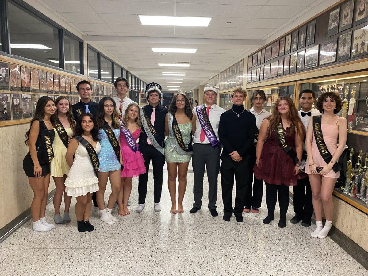 The 2025 homecoming court pose for a picture before being announced at the dance. 