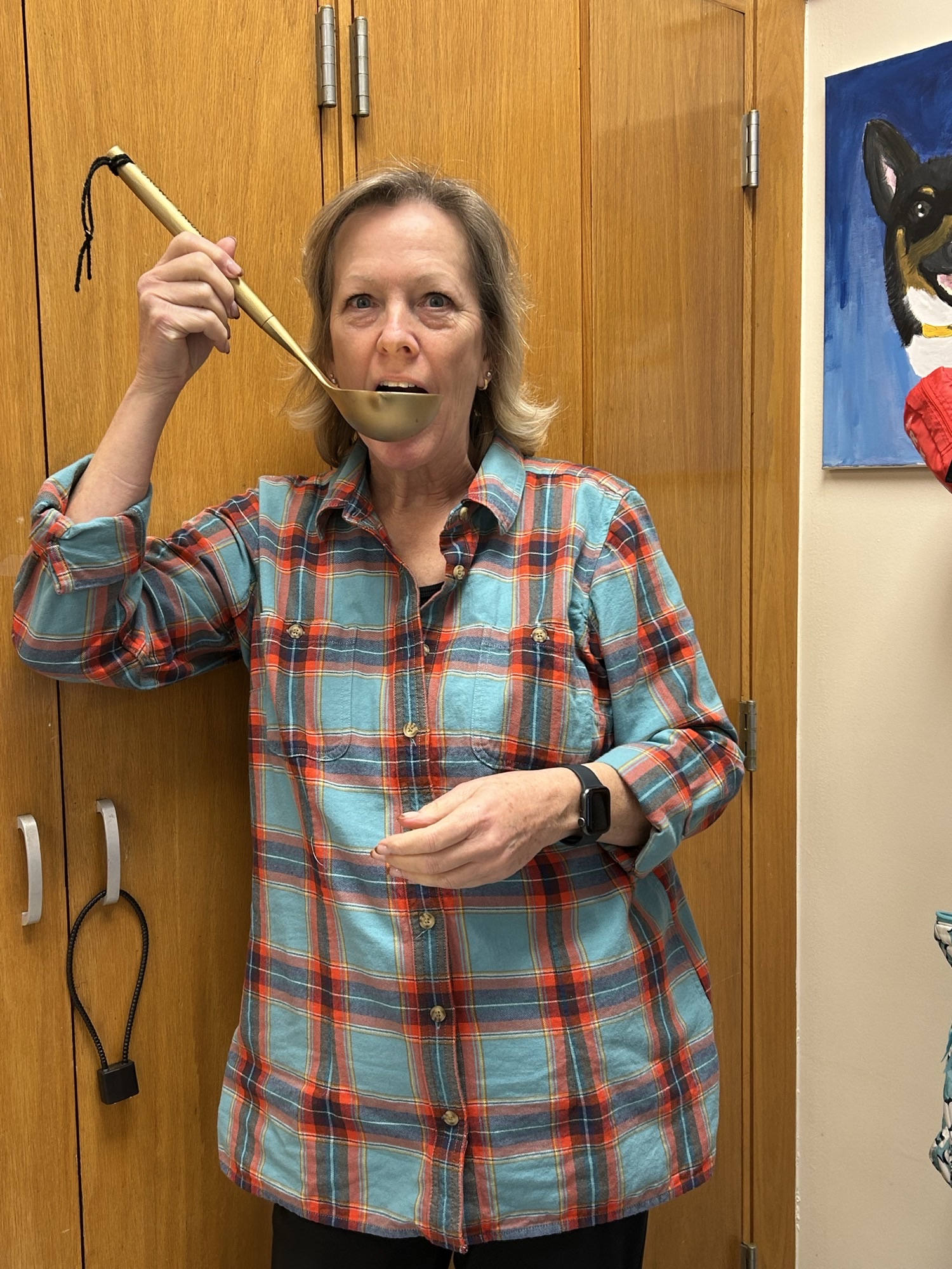 Lisa Nicholas, winner of the Chili Cook-Off, holding The Golden Ladle.
