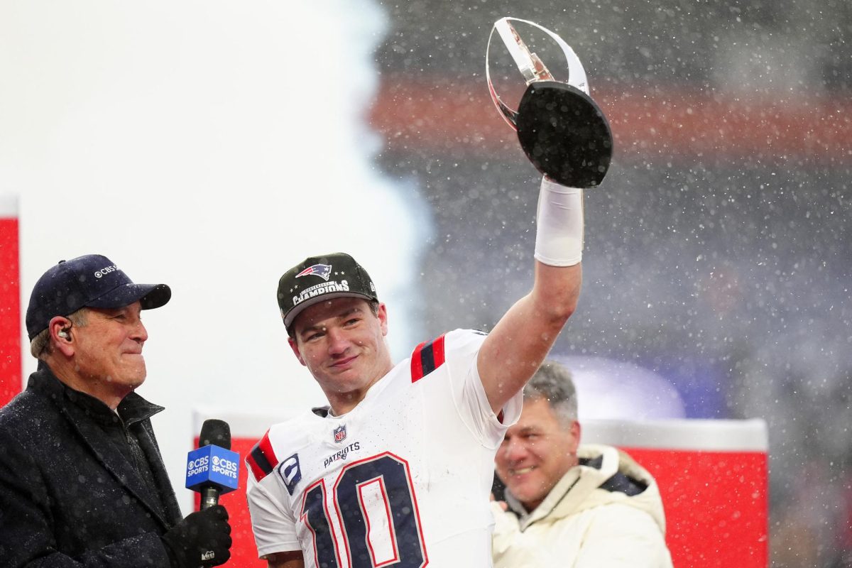 Jan 25, 2026; Denver, CO, USA; New England Patriots quarterback Drake Maye (10) holds the AFC Championship trophy while speaking to the media after defeating the Denver Broncos in the 2026 AFC Championship Game at Empower Field at Mile High. Mandatory Credit: Ron Chenoy-Imagn Images