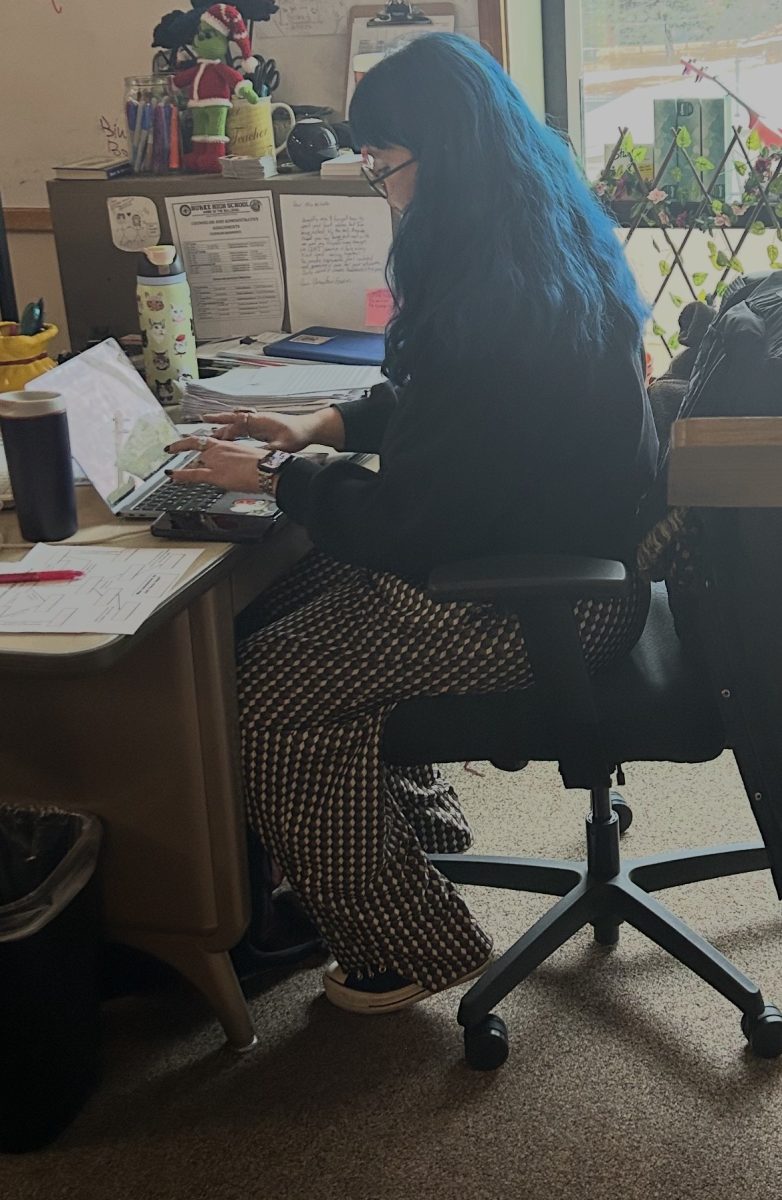 Mrs. Mitchell at our weekly Wednesday meeting making a form for our valentine's party so she knows what we’ll bring.

