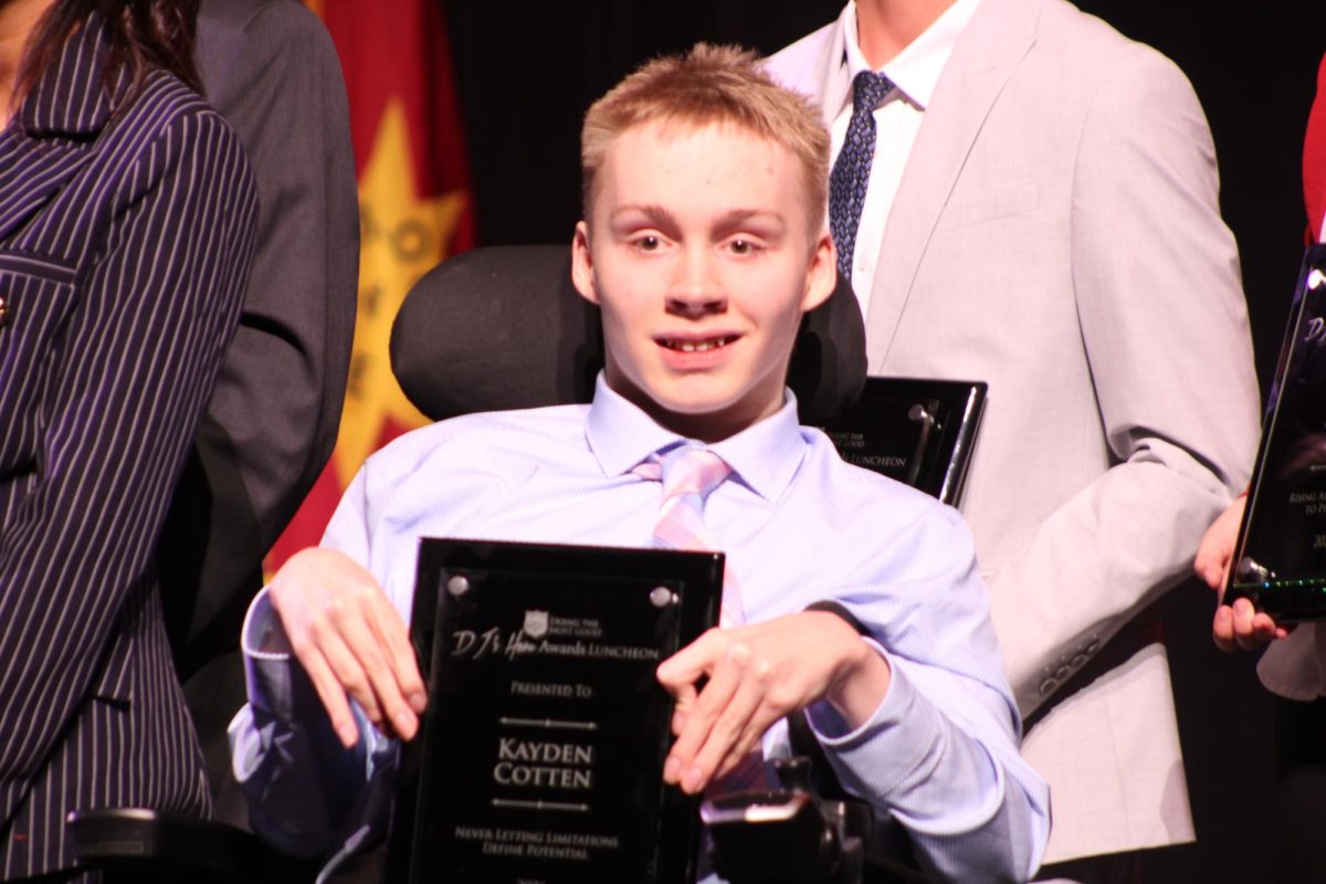 Senior Kayden Cotten receives the DJ's Hero award in Omaha in early May 2026.