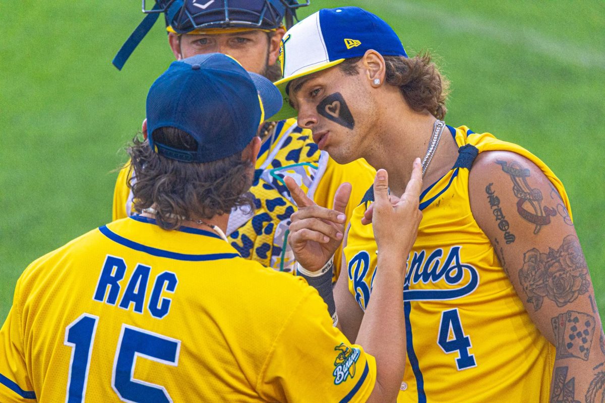 RobertAnthony Cruz (left) and KJ Jackson share a moment before the Savannah Bananas game against The Fire Fighters on Saturday, June 13 at Memorial Stadium in Lincoln.